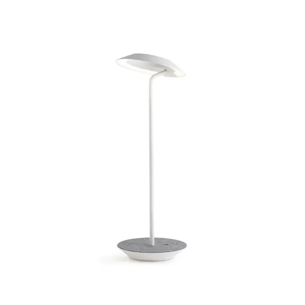 The Royyo Desk lamp adds an elegant flair to any space with its minimal wiring and pleasing circular design. Its minimal silhouette houses complex inner technology for a marriage of form and functionality. Royyo's embedded USB port allows users to charge any USB - compatible device. Interchangeable base plate options allow users to customize at ease. Achieve unity in design by inviting the Royyo Floor Lamp, Royyo Pendant and Royyo Desk Lamp into your home. Collection: Royyo Designer: Kenneth Ng, Edmund Ng Finish: Matte White, Oxford Felt Width: 6.40" Height: 17.40" Length: 6.40" Weight: 2.60 lb Bulbs Included Maximum Wattage: 11.00 W Bulb Type: LED Bulb Base: Integrated Light Source: LED Light Output: 600.00 lm Color Temperature: 3000 K CRI: 90 Voltage: 120.00 V Material: Aluminum, plastic Country of Origin: China Safety Listing: UL, CUL Safety Rating: Damp LED Manufacturer Warranty: 5 years Spec Sheet