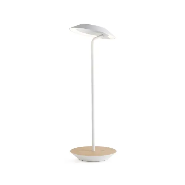 The Royyo Desk lamp adds an elegant flair to any space with its minimal wiring and pleasing circular design. Its minimal silhouette houses complex inner technology for a marriage of form and functionality. Royyo's embedded USB port allows users to charge any USB - compatible device. Interchangeable base plate options allow users to customize at ease. Achieve unity in design by inviting the Royyo Floor Lamp, Royyo Pendant and Royyo Desk Lamp into your home. Collection: Royyo Designer: Kenneth Ng, Edmund Ng Finish: Matte White, White Oak Width: 6.40" Height: 17.40" Length: 6.40" Weight: 2.60 lb Bulbs Included Maximum Wattage: 11.00 W Bulb Type: LED Bulb Base: Integrated Light Source: LED Light Output: 600.00 lm Color Temperature: 3000 K CRI: 90 Voltage: 120.00 V Material: Aluminum, plastic Country of Origin: China Safety Listing: UL, CUL Safety Rating: Damp LED Manufacturer Warranty: 5 years Spec Sheet