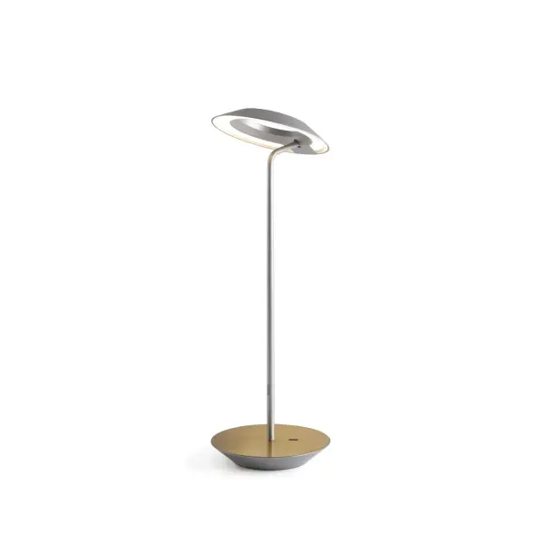The Royyo Desk lamp adds an elegant flair to any space with its minimal wiring and pleasing circular design. Its minimal silhouette houses complex inner technology for a marriage of form and functionality. Royyo's embedded USB port allows users to charge any USB - compatible device. Interchangeable base plate options allow users to customize at ease. Achieve unity in design by inviting the Royyo Floor Lamp, Royyo Pendant and Royyo Desk Lamp into your home. Collection: Royyo Designer: Kenneth Ng, Edmund Ng Finish: Silver, Brass Width: 6.40" Height: 17.40" Length: 6.40" Weight: 2.60 lb Bulbs Included Maximum Wattage: 11.00 W Bulb Type: LED Bulb Base: Integrated Light Source: LED Light Output: 600.00 lm Color Temperature: 3000 K CRI: 90 Voltage: 120.00 V Material: Aluminum, plastic Country of Origin: China Safety Listing: UL, CUL Safety Rating: Damp LED Manufacturer Warranty: 5 years Spec Sheet