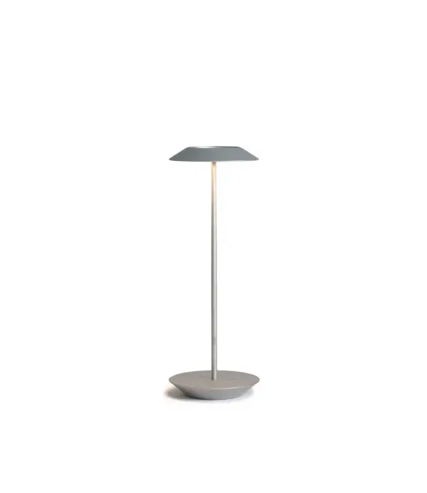 The Royyo Desk lamp adds an elegant flair to any space with its minimal wiring and pleasing circular design. Its minimal silhouette houses complex inner technology for a marriage of form and functionality. Royyo's embedded USB port allows users to charge any USB - compatible device. Interchangeable base plate options allow users to customize at ease. Achieve unity in design by inviting the Royyo Floor Lamp, Royyo Pendant and Royyo Desk Lamp into your home. Collection: Royyo Designer: Kenneth Ng, Edmund Ng Finish: Silver Width: 6.40" Height: 17.40" Length: 6.40" Weight: 2.60 lb Bulbs Included Maximum Wattage: 11.00 W Bulb Type: LED Bulb Base: Integrated Light Source: LED Light Output: 600.00 lm Color Temperature: 3000 K CRI: 90 Voltage: 120.00 V Material: Aluminum, plastic Country of Origin: China Safety Listing: UL, CUL Safety Rating: Damp LED Manufacturer Warranty: 5 years Spec Sheet