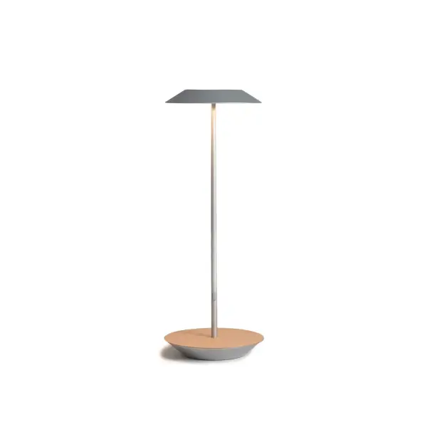 The Royyo Desk lamp adds an elegant flair to any space with its minimal wiring and pleasing circular design. Its minimal silhouette houses complex inner technology for a marriage of form and functionality. Royyo's embedded USB port allows users to charge any USB - compatible device. Interchangeable base plate options allow users to customize at ease. Achieve unity in design by inviting the Royyo Floor Lamp, Royyo Pendant and Royyo Desk Lamp into your home. Collection: Royyo Designer: Kenneth Ng, Edmund Ng Finish: Silver, White Oak Width: 6.40" Height: 17.40" Length: 6.40" Weight: 2.60 lb Bulbs Included Maximum Wattage: 11.00 W Bulb Type: LED Bulb Base: Integrated Light Source: LED Light Output: 600.00 lm Color Temperature: 3000 K CRI: 90 Voltage: 120.00 V Material: Aluminum, plastic Country of Origin: China Safety Listing: UL, CUL Safety Rating: Damp LED Manufacturer Warranty: 5 years Spec Sheet
