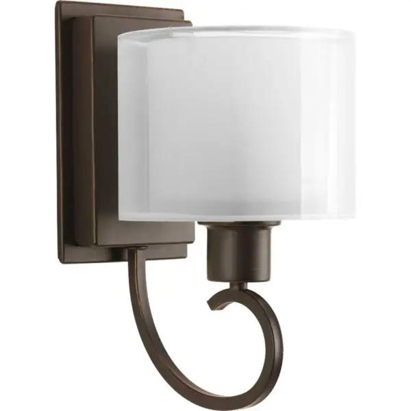 Invite the beauty of light into your home with this Antique Bronze one-light wall bracket. Invite provides a welcoming silhouette with a unique shade comprised of an inner glass globe encircled by a translucent sheer Mylar shade. The rich, layering effect creates a dreamy look that is both elegant and modern. Offered as a complete collection, the Invite styling can be carried throughout your home or as a focal style in a special room. Collection: Invite Rooms: Bathroom,Hall & Foyer Finish: Antique Bronze Glass: White Width: 6.50" Height: 11.50" Length: 6.50" Weight: 5.00 lb Extension from Wall: 8.25" Top to Outlet: 3.75" Wire: 6" Canopy: 6.4375" Number of Bulbs: 1 Maximum Wattage: 100.00 W Bulb Type: Medium Bulb Base: E26 Light Source: Incandescent Voltage: 120.00 V Material: Steel Country of Origin: CN Safety Listing: UL-CUL Safety Rating: Damp Title 20 Manufacturer Warranty: 1-year Limited Warranty Spec Sheet Instructions Parts Diagram