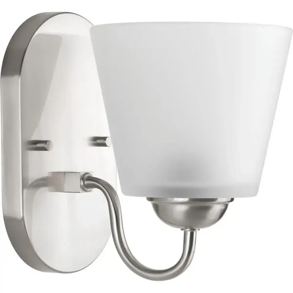 The Arden one-light vanity fixture offers a versatile brushed nickel finish that complements both traditional and contemporary bathrooms. Its compact design makes it ideal for powder rooms and smaller vanities.