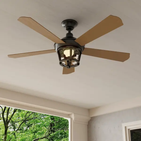 The Smyrna 52" ceiling fan combines traditional styling with modern versatility, featuring a durable Antique Bronze finish suitable for both indoor and outdoor spaces. Five blades provide efficient air circulation. - alternate view