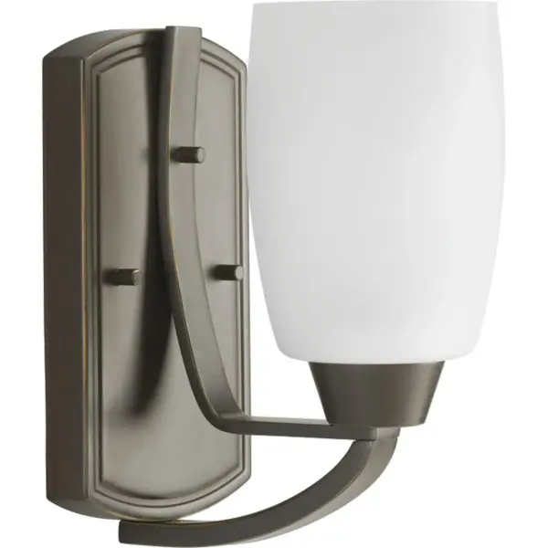 The Wisten vanity light combines brushed nickel hardware with etched glass for a refined, modern aesthetic. Its compact single-light design provides focused task lighting ideal for smaller bathrooms and powder rooms.