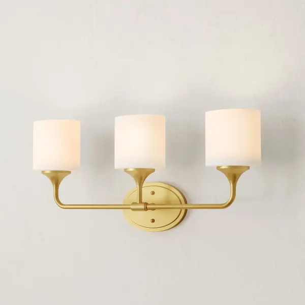 The Lynzie vanity light combines polished chrome hardware with etched opal glass shades for a sophisticated, transitional look. Perfect for modern bathrooms seeking clean lines with soft, diffused lighting. - alternate view