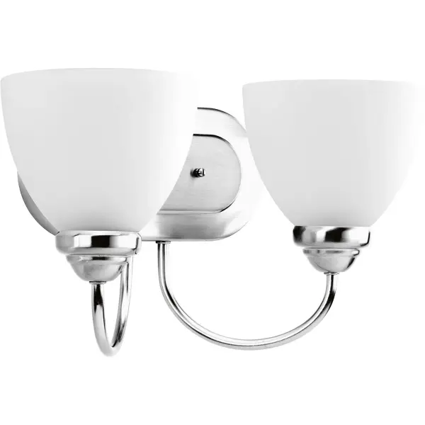 The Heart Collection vanity light combines timeless farmhouse style with practical two-light illumination. Etched glass shades soften the light while brushed nickel finish adds refined elegance to any bathroom.