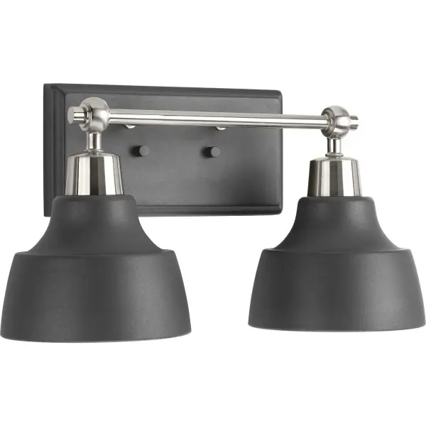 The Bramlett two-light vanity fixture combines farmhouse charm with coastal simplicity through brushed nickel finish and metal shades. JA8 compliant for California installations, it delivers functional lighting for bathrooms.