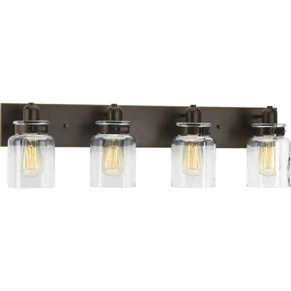The Calhoun vanity light blends rustic farmhouse style with transitional versatility. Four clear glass shades and brushed nickel finish provide ample illumination while complementing both traditional and contemporary bathrooms. - alternate view