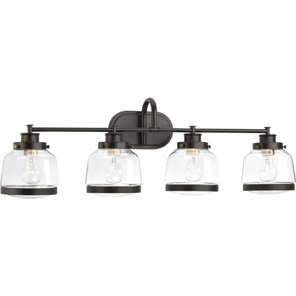 The Judson four-light vanity fixture combines rustic farmhouse charm with clear glass shades and antique bronze finish. JA8 compliant for California energy standards, this versatile fixture provides ample illumination for bathrooms.