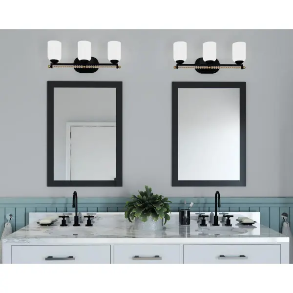 The Carlyn Collection brings sophisticated transitional style to bathroom lighting with its three-light configuration and warm Antique Bronze finish. JA8 compliant for California energy standards, this vanity fixture balances traditional elegance with modern efficiency. - alternate view
