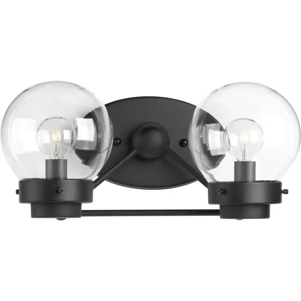 The Spatial Collection vanity light combines contemporary black finish with clear glass shades for a clean, modern aesthetic. Perfect for bathrooms seeking functional lighting with minimalist style.