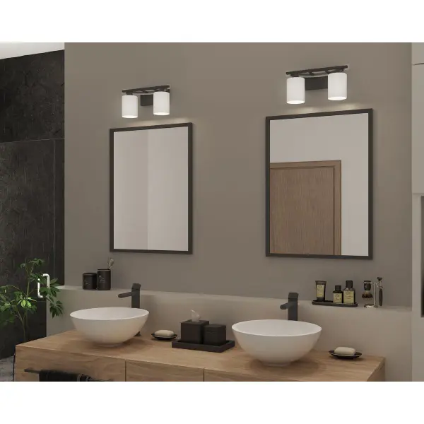 The Dart Collection vanity light combines sleek graphite finish with etched glass shades for even, flattering bathroom illumination. JA8-compliant for California energy standards, this two-light fixture offers modern styling at an accessible price point. - alternate view