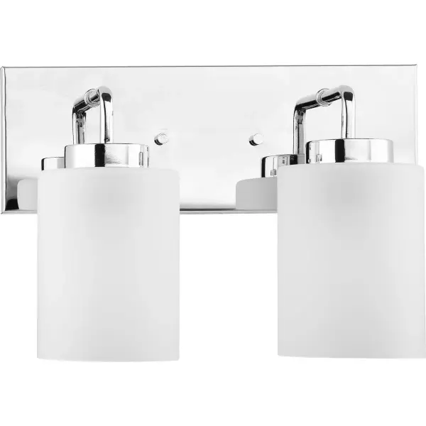 The Merry vanity light combines brushed nickel hardware with etched glass shades for a versatile transitional aesthetic. Its two-light configuration provides balanced illumination ideal for bathroom vanities.