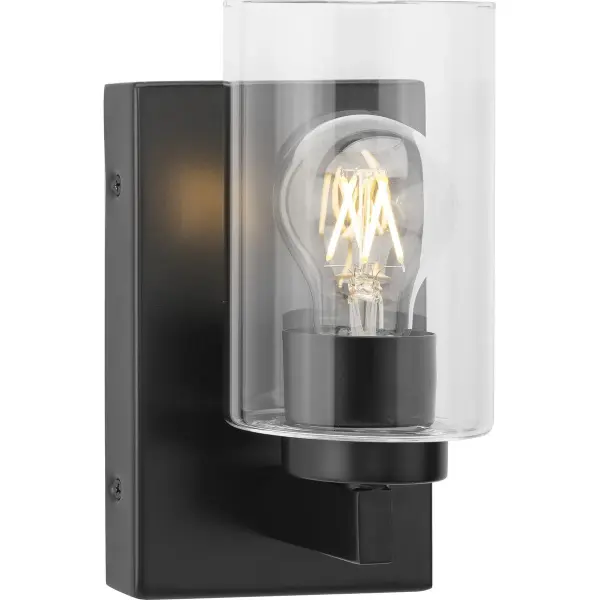 The Goodwin vanity light combines brushed nickel finish with clear glass for a versatile, modern look. Its single-light design offers focused illumination perfect for smaller bathrooms and powder rooms. - alternate view