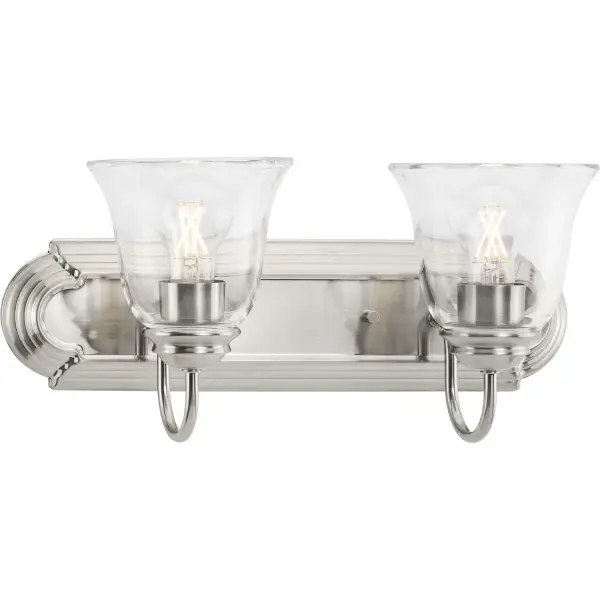 This traditional vanity light combines brushed nickel metalwork with clear glass shades for bright, functional bathroom lighting. JA8 and Title 20/22 compliant for California installations. - alternate view
