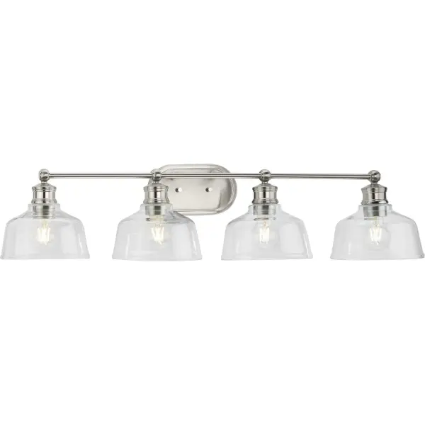 The Singleton vanity light combines vintage brass warmth with clear glass shades for a sophisticated industrial-farmhouse aesthetic. At 36 inches wide, it's perfectly sized for double vanities and master bathrooms. - alternate view
