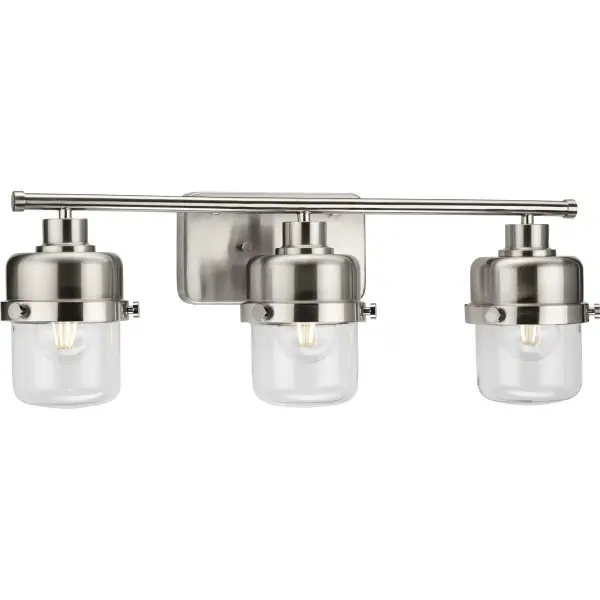 The Beckner vanity light combines mid-century modern aesthetics with transitional versatility. Three clear glass globes provide excellent task lighting while the brushed nickel finish adds sophistication to any bathroom. - alternate view