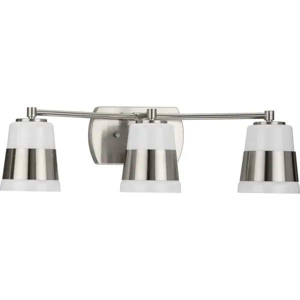 The Haven Collection brings timeless mid-century style to bathroom lighting with vintage brass finish and soft opal glass shades. Three lights provide excellent illumination for vanity tasks while adding sophisticated warmth.