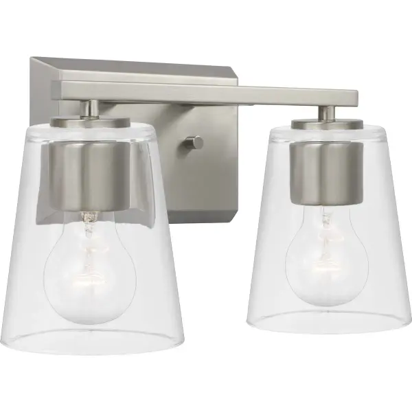The Vertex bath light combines contemporary styling with practical illumination. Its brushed nickel finish and clear glass shades create a clean, sophisticated look perfect for modern bathrooms.