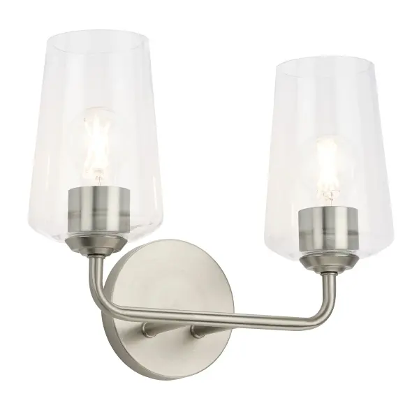 The Celino two-light vanity fixture offers a refined brushed nickel finish that complements both traditional and contemporary bathrooms. Its compact profile makes it ideal for powder rooms and guest baths.