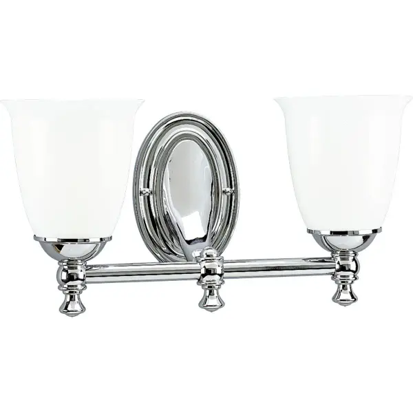 This two-light vanity fixture combines timeless Victorian elegance with farmhouse simplicity. White opal glass shades provide soft, even illumination while the brushed nickel finish adds contemporary appeal.