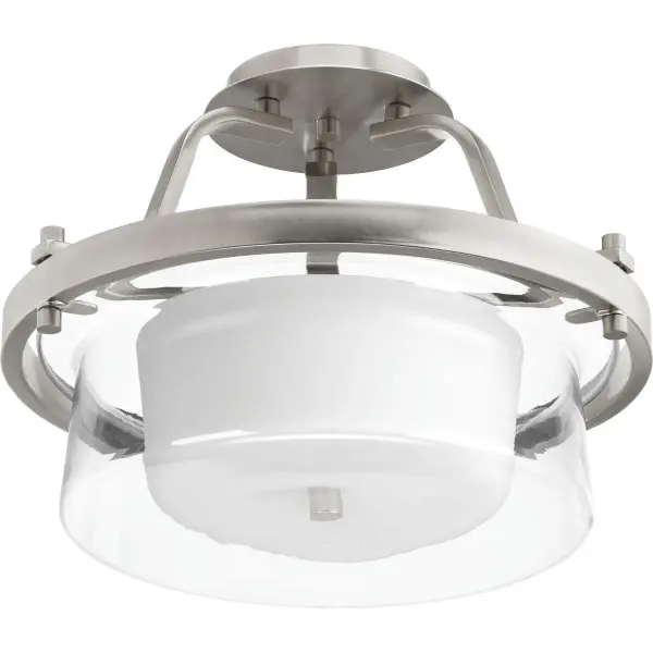 The Indulge Collection offers a refined two-light semi-flush design perfect for spaces with lower ceilings. Its brushed nickel finish and glass shades provide timeless appeal across traditional and contemporary interiors.