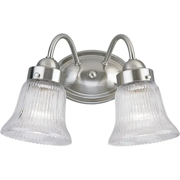 This two-light vanity fixture combines timeless fluted glass shades with a brushed nickel finish, offering excellent task lighting for bathrooms. The traditional styling works well in both classic and transitional spaces. - alternate view