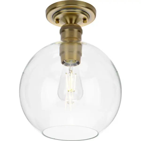 The Hansford flush mount combines transitional elegance with practical functionality. Its 10-inch profile and vintage brass finish bring warmth to any space while maintaining a low ceiling clearance ideal for standard height rooms.
