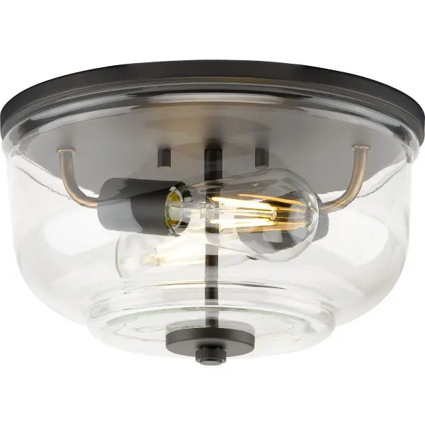 The Rushton flush mount combines farmhouse charm with industrial edge, featuring clear glass shades and brushed nickel finish. Perfect for low-ceiling spaces, this two-light fixture provides ample illumination while maintaining a compact profile. JA8 and Title 22 compliant for California installations.
