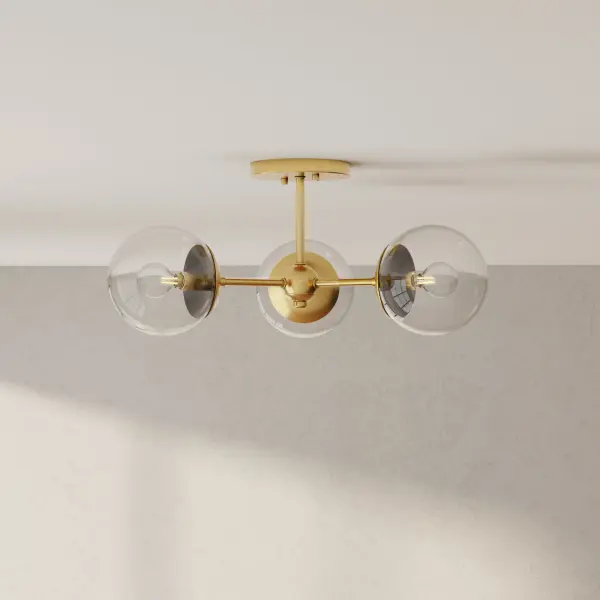 The Atwell semi-flush mount combines timeless mid-century aesthetics with contemporary finishes. Its three-light configuration provides ample illumination while maintaining a low profile perfect for standard ceiling heights. - alternate view