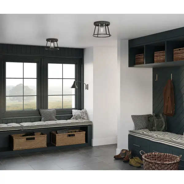 The Laramie combines rustic charm with industrial edge in a compact 12" flush mount. Clear seeded glass adds vintage texture while matte black finish provides modern contrast. Ideal for low ceilings and tight spaces. - alternate view