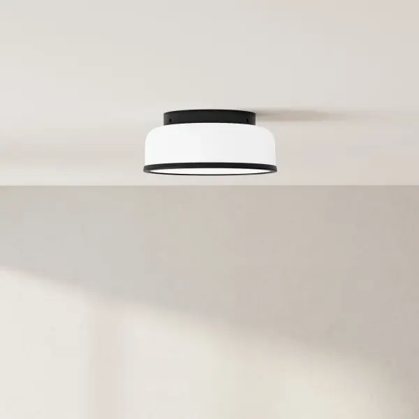 The Parkhurst flush mount combines clean contemporary lines with transitional warmth, making it ideal for bedrooms, hallways, and foyers. Its compact 11-1/4" profile fits low ceilings while providing ample two-light illumination.
