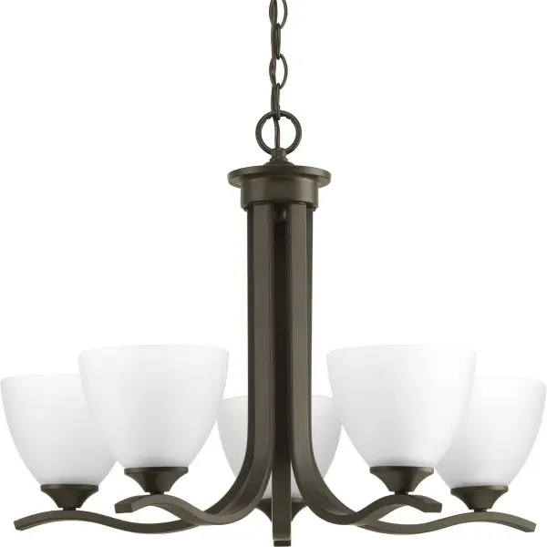 The Laird chandelier combines traditional elegance with versatile styling through its five-light configuration and etched glass shades. The Antique Bronze finish adds warmth and character to dining rooms and kitchens.