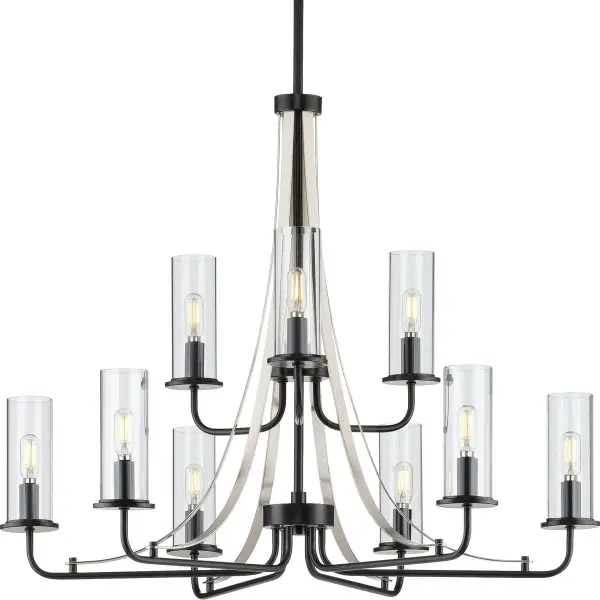 The Riley Collection chandelier combines classic elegance with modern simplicity. Nine lights with clear glass shades provide ample illumination while the black finish adds contemporary contrast. Perfect for dining rooms and kitchens.