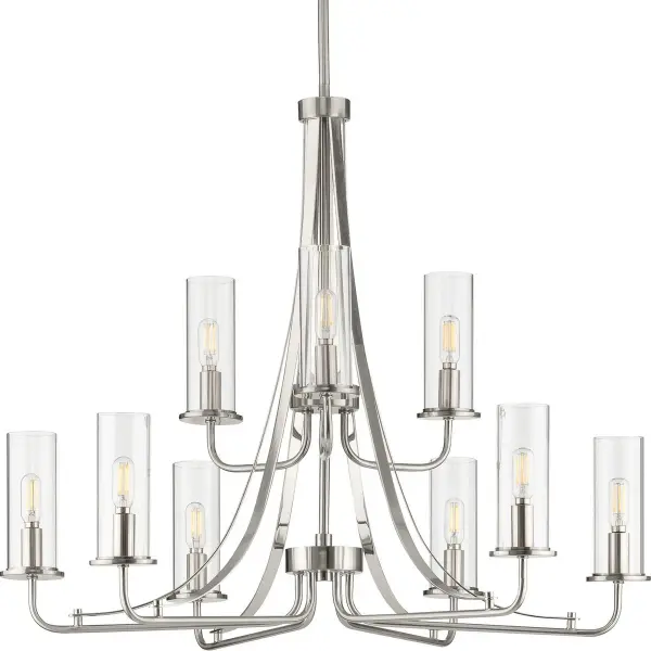 The Riley Collection chandelier combines classic elegance with modern simplicity. Nine lights with clear glass shades provide ample illumination while the black finish adds contemporary contrast. Perfect for dining rooms and kitchens. - alternate view