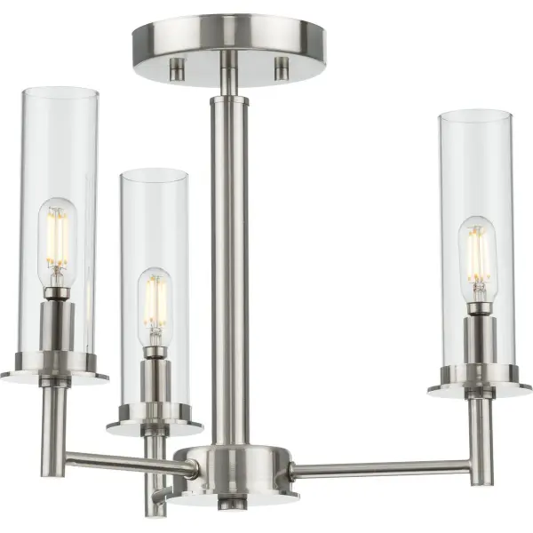 The Kellwyn combines clean transitional styling with practical versatility. Its convertible design allows installation as either a semi-flush mount or hanging pendant, while clear glass shades and brushed nickel finish complement diverse interiors.