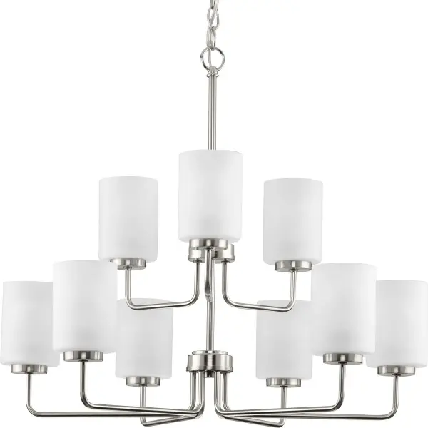 The Merry Collection chandelier combines transitional styling with contemporary flair, featuring nine lights and etched glass shades. Its brushed nickel finish and generous scale make it perfect for dining rooms and grand entryways.