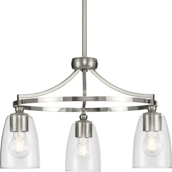 The Parkhurst chandelier blends farmhouse warmth with modern simplicity through its three-light design and clear glass shades. The brushed nickel finish adds contemporary polish while maintaining transitional appeal.