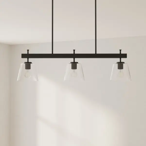 The Saffert linear chandelier combines urban industrial style with transitional versatility. Three clear glass shades suspended from a brushed nickel frame deliver focused task lighting perfect for kitchen islands and dining tables.