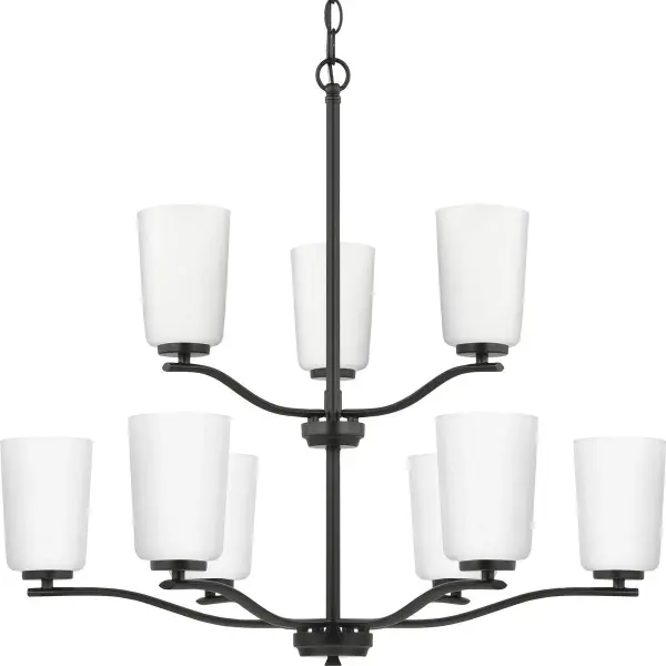 The Adley Collection chandelier combines classic elegance with contemporary sensibility through nine etched white glass shades and brushed nickel finish. Perfect for creating a sophisticated focal point in dining rooms and foyers.