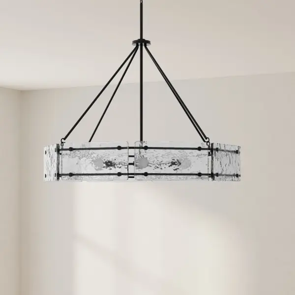 The Rivera Collection chandelier combines modern farmhouse charm with industrial sophistication. Six lights provide ample illumination while the matte black finish adds contemporary drama to any space.