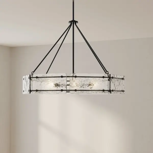 The Rivera Collection chandelier combines modern farmhouse charm with industrial sophistication. Six lights provide ample illumination while the matte black finish adds contemporary drama to any space. - alternate view