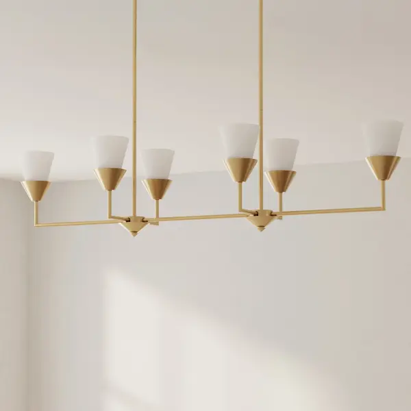 The Pinellas six-light linear chandelier brings sophisticated coastal elegance with its white plaster finish. Perfect for kitchen islands and dining rooms, this fixture combines traditional craftsmanship with versatile styling.