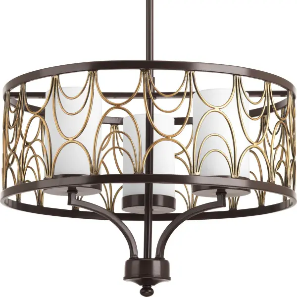 The Cirrine chandelier combines classic etched white glass shades with an antique bronze finish, creating a versatile fixture that bridges traditional and contemporary styles. Perfect for intimate dining spaces and breakfast nooks.