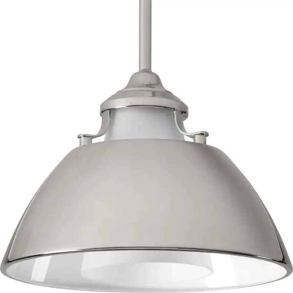 The Carbon Collection pendant combines clean mid-century lines with etched white glass for a sophisticated look. Its graphite finish and compact size make it versatile for various spaces, from kitchen islands to bedrooms.