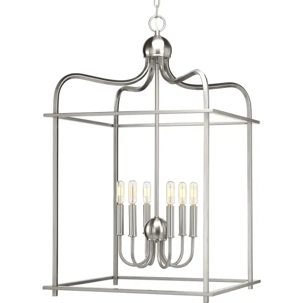 The Assembly Hall pendant brings airy coastal elegance with six lights in a brushed nickel finish. Its generous scale and clean design work beautifully over dining tables or kitchen islands, offering ample illumination with sophisticated style.