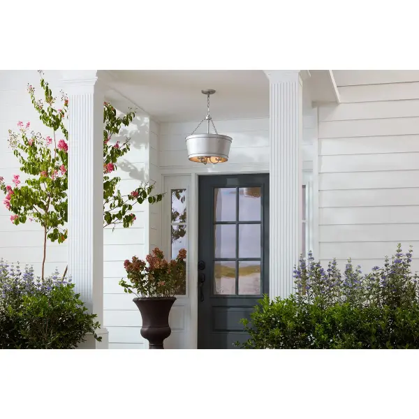 The Galveston three-light pendant brings authentic farmhouse style to outdoor and indoor spaces with its durable galvanized metal finish. Perfect for covered porches, patios, or rustic kitchens seeking industrial charm. - alternate view