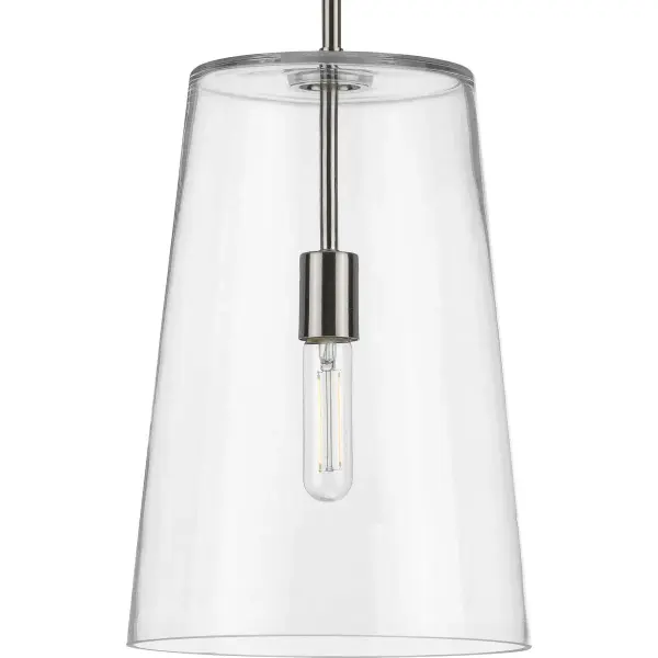 The Clarion pendant combines clean lines with coastal charm through its clear glass shade and brushed nickel finish. Perfect for creating a light, airy feel in kitchens and dining spaces while providing focused task lighting.