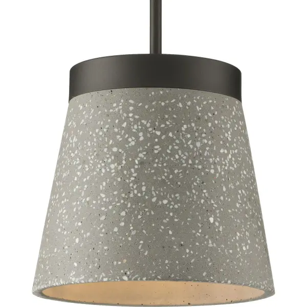 The Terrazzo pendant blends transitional elegance with industrial flair in a sophisticated graphite finish. Its compact single-light design makes it perfect for kitchen islands, dining nooks, or bedroom task lighting.